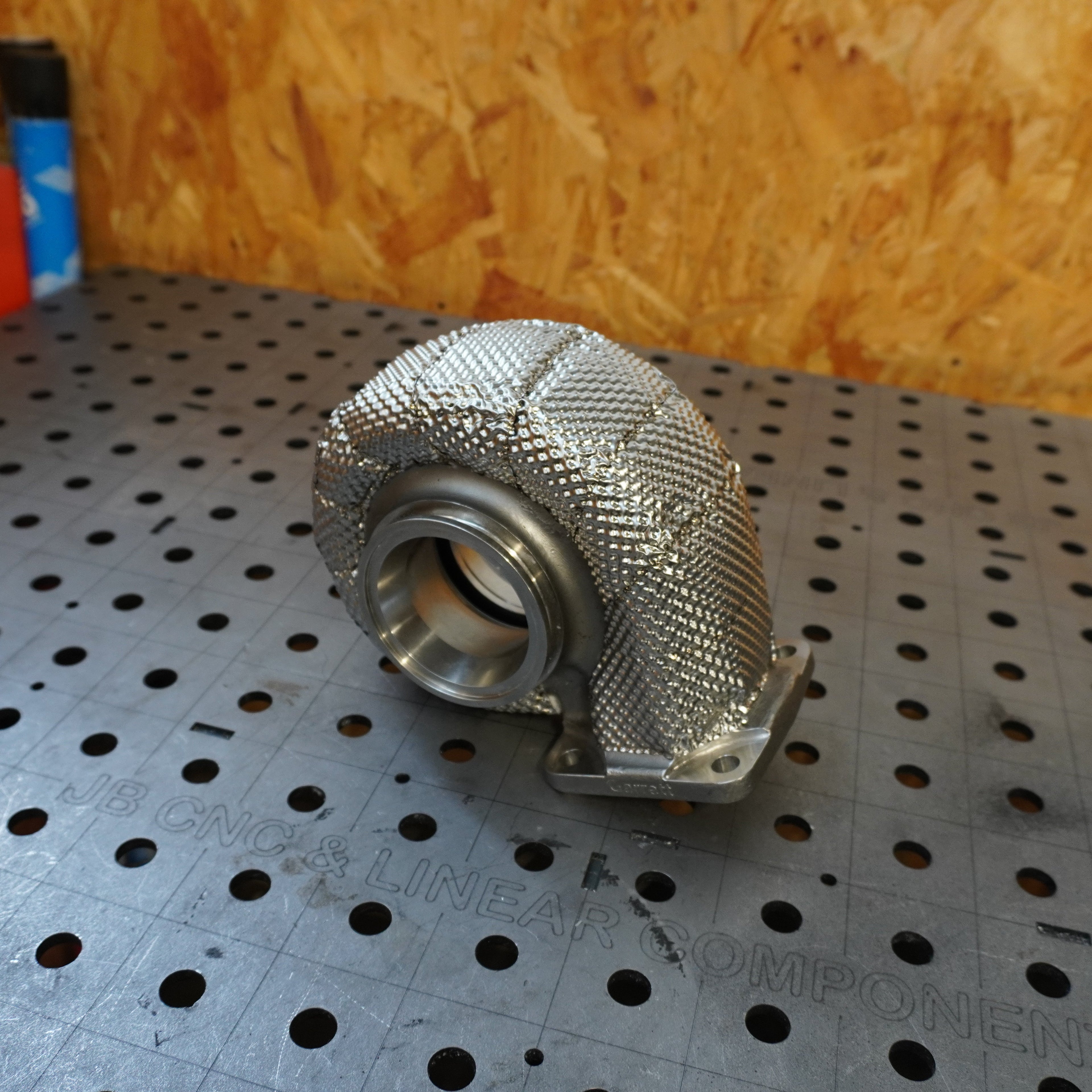 Heat wrap turbo exhaust housing