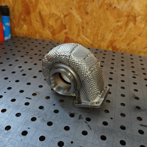 Heat wrap turbo exhaust housing